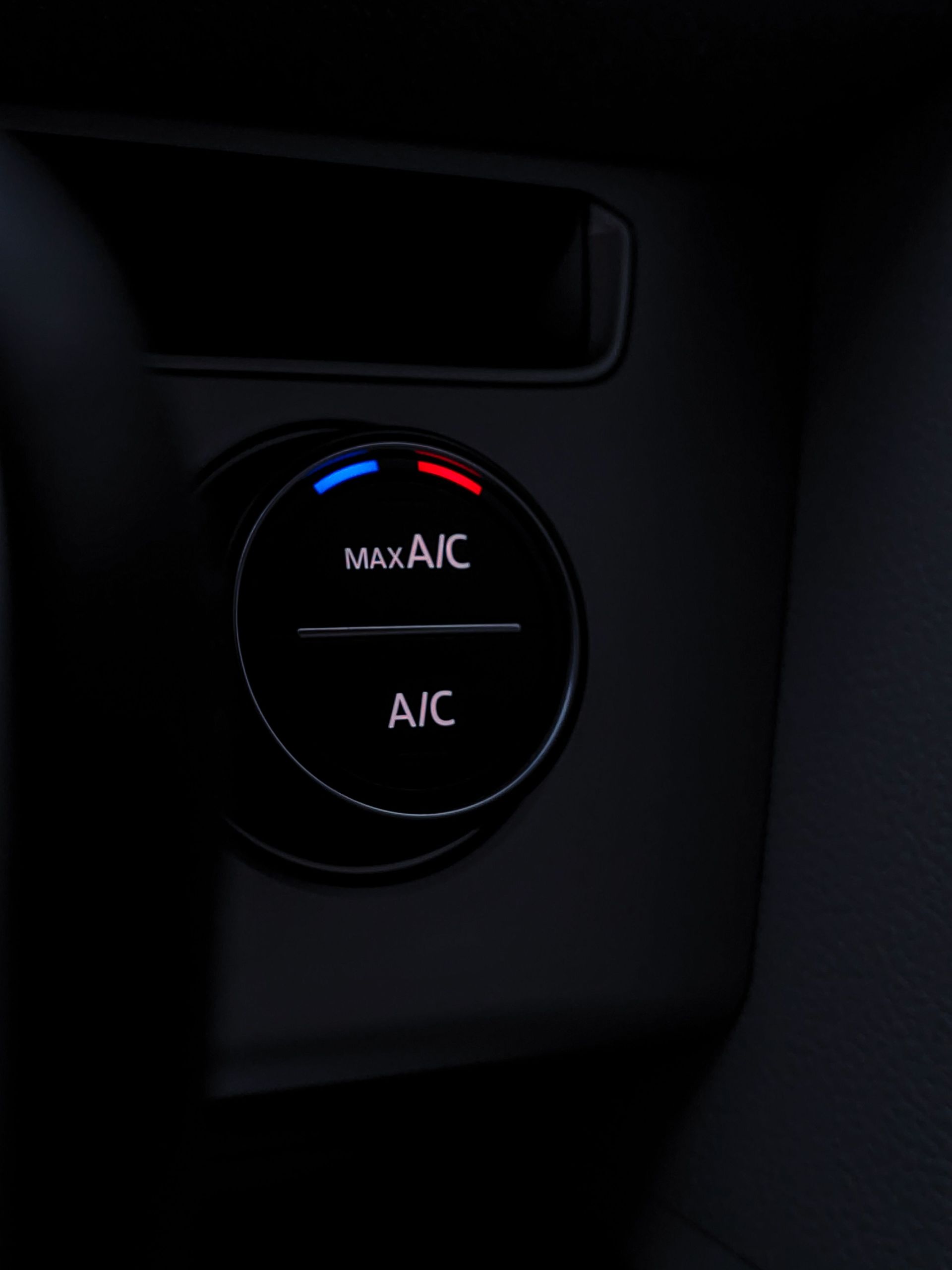 Detailed view of a car air conditioning control knob, highlighting its modern design and functionality.
